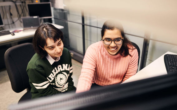 Students working together on a computer 